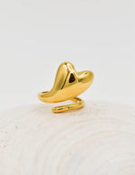 Gold pinky ring with abstract heart-shaped drop on shell