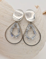 silver dangly earrings with geometric crystal accents, trendy canadian clean girl jewellery 2025