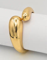 gold version worn on wrist with linen blazer for brunch look