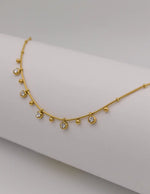 Minimalist gold necklace with dainty zircon and bead charms