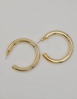 golden_charm_hoop_on_hoop_earrings montreal minimalist jewellery trend