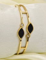 modern_open_golden_bracelet_with_black_stones_and_clear_gemstones