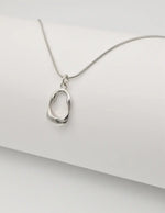 minimalist gold chain with a sleek round pendant inspired by montreal style