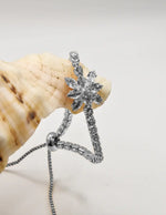 radiant_blossom_happy_face_bracelet_closeup_on_elegant_silver_floral_charm_canada