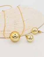 gold circle pendant necklace canada paired with bold round stud earrings, dainty yet modern layering necklaces for women montreal style