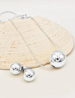 silver radiant orb jewelry set with bold circle pendant necklace and earrings perfect for layering jewelry for women in canada