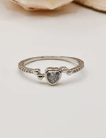 Silver Glow Heart Eternity Ring with a sparkling heart‑shaped stone set in a delicate pave band; this minimalist jewellery is ideal for Canadian shoppers seeking TikTok viral accessories and a dainty gift for her.