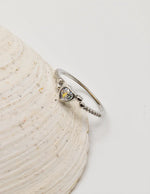 Side profile of the Silver Glow Heart Eternity Ring featuring a pavé‑set band and bezel‑set heart solitaire; dainty jewellery that pairs well with layering necklaces for women and makes a perfect gift for her