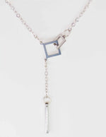 Minimalist silver necklace featuring bar drop charm