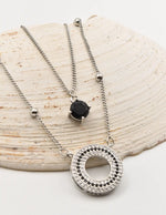 layered silver circle pendant necklace with round black stone charm, Montreal minimalist jewelry for clean girl style