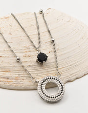 layered silver circle pendant necklace with round black stone charm, Montreal minimalist jewelry for clean girl style