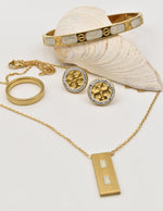 clean girl jewelry 2025 featuring dainty gold bracelet, circle pendant necklace and minimalist ring, montreal black friday jewelry deals