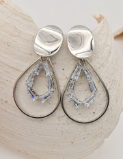 silver dangly earrings with geometric crystal accents, trendy canadian clean girl jewellery 2025
