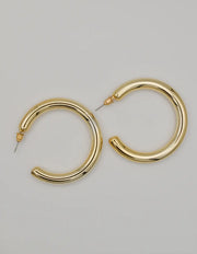 golden_charm_hoop_on_hoop_earrings montreal minimalist jewellery trend