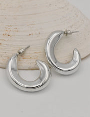 curved silver earrings crescent moon style montreal minimalist jewelry