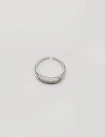 Minimalist engagement ring styled with other jewellery