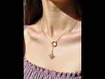 Close-up of gold layering necklace with sparkle charm video