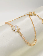 adiant_blossom_happy_face_bracelet_close_up_floral_centerpiece_golden_chain