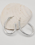shiny_silver_hoop_earrings_canada_minimalist_jewelry_radiant_glow_earrings