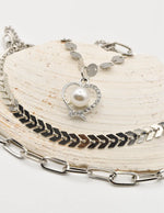 sparkle pearl christmas necklace featuring heart pendant and layered silver chain set – montreal minimalist jewelry and tiktok viral necklaces