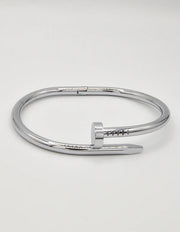 Stylish silver twist nail bracelet, minimalist Canadian streetwear jewellery.