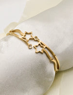 stellar_twinkle_golden_bracelet_for_women_golden_star_cutout_bangle_with_diamond_like_gems_canada_accessories