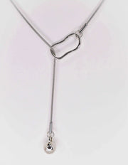 Modern silver necklace on white background, clean design